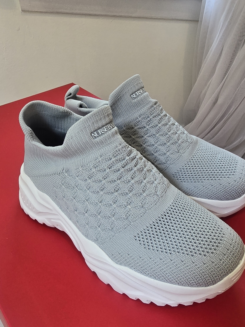 Nurse Belle Slip-On Knit Sneakers in Light Gray